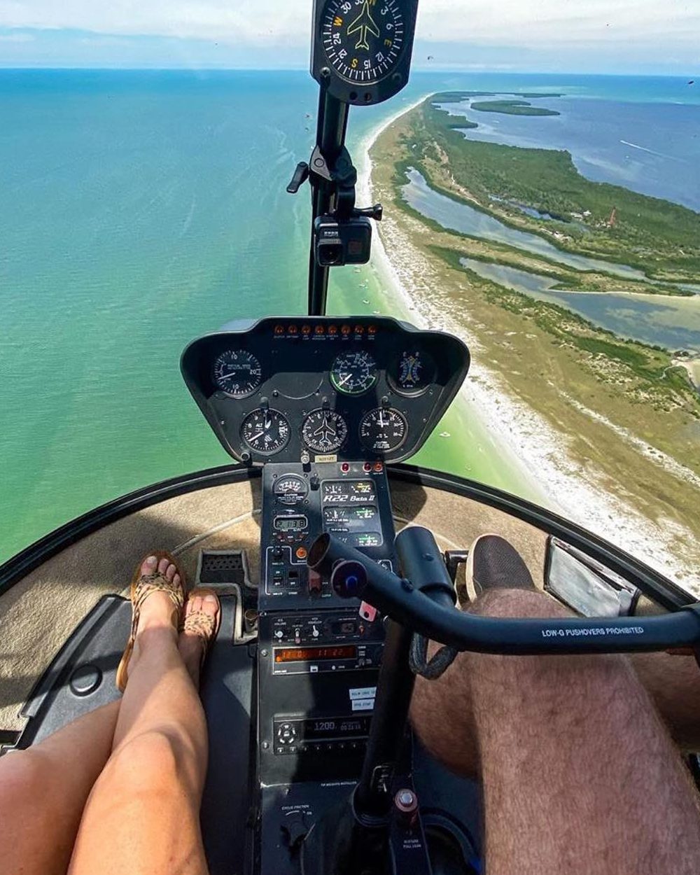 couple in helicopter. perspective shot from above. 